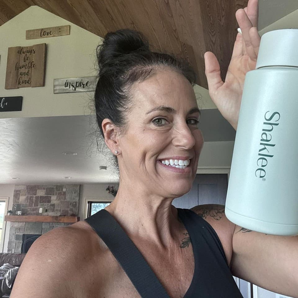 Terri Klapperich with her Shaklee water bottle at home